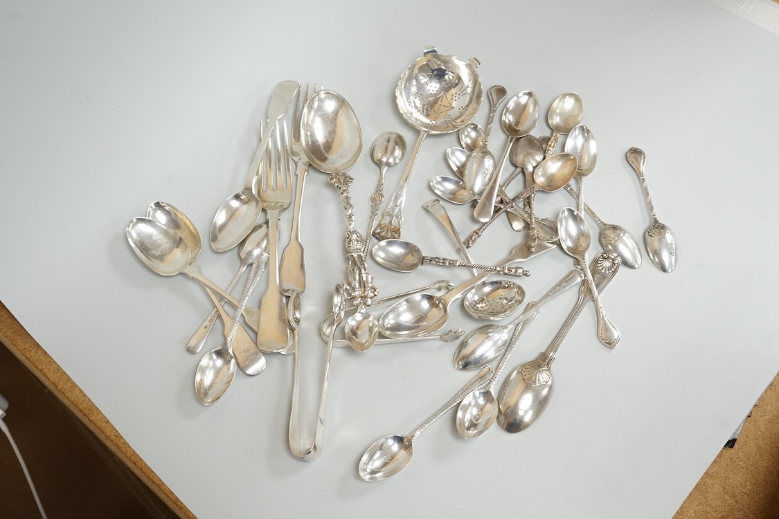 A small group of assorted mainly 20th century silver flatware, including teaspoons, replica spoons, dessert forks, sifter spoon, tea strainer, condiment spoons, Dutch white metal spoons, etc, various dates and makers, 17